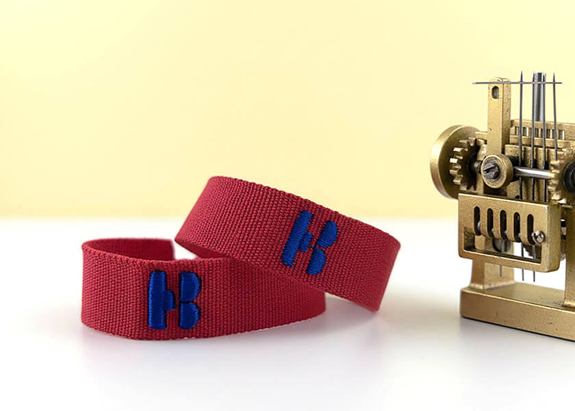 Gewebtes Armband mit Logo und Text als individuelles Giveaway für Promotion und Merchandise