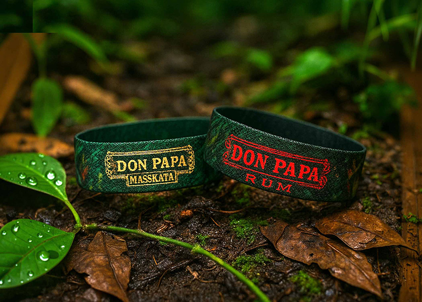 Promotional wristband made of elastic material, reversible, with individual logo and text printing in individual color.